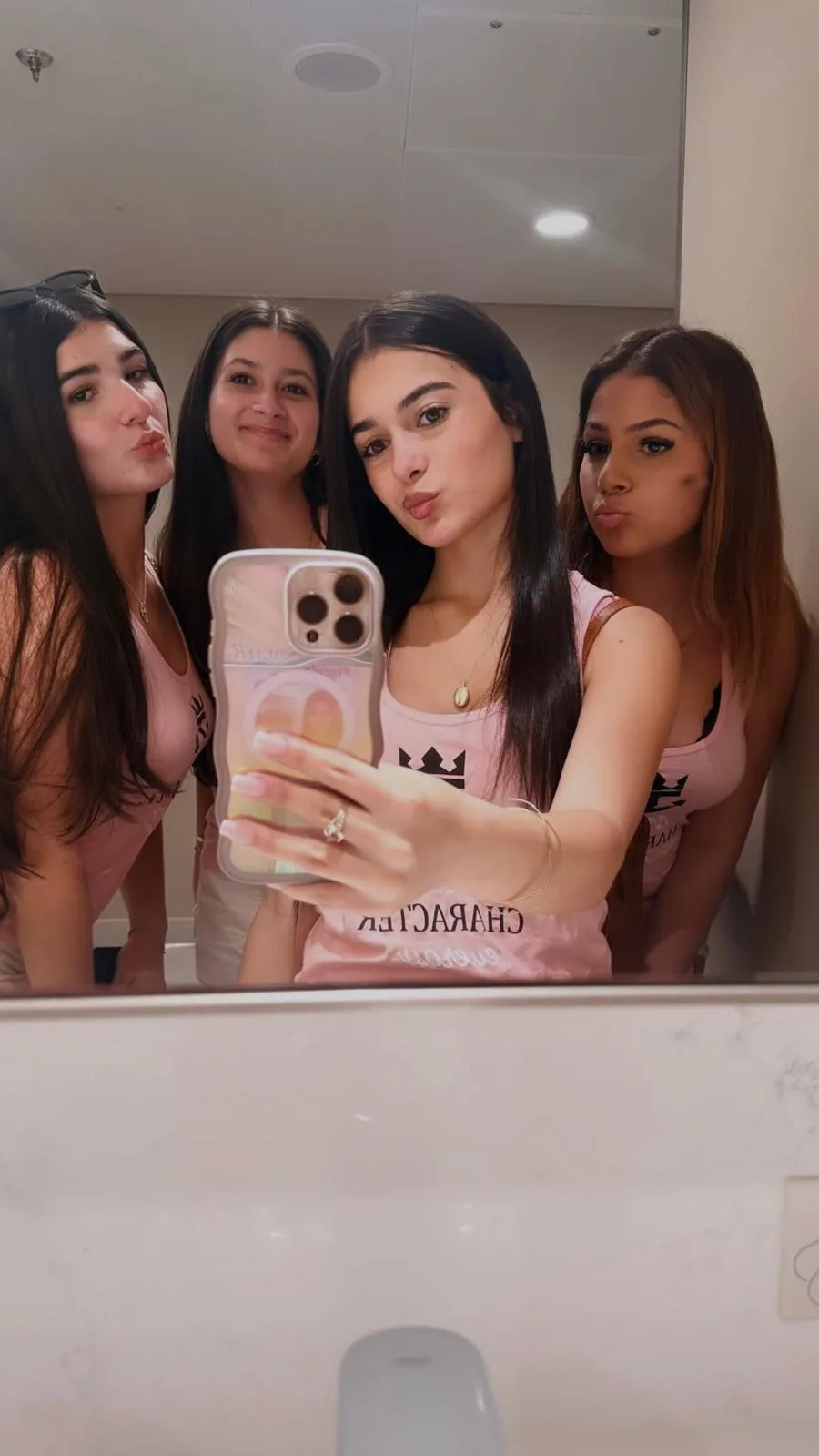 Friends sharing a mirror photograph