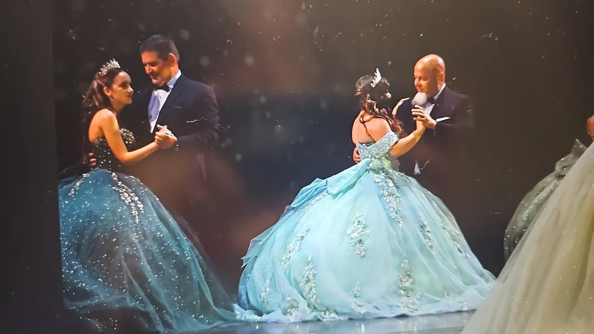Quinceañeras dancing with their families