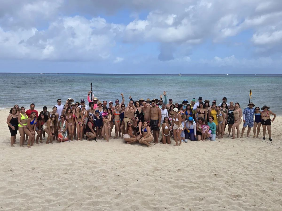 Travel Angels guests posing together on a beach