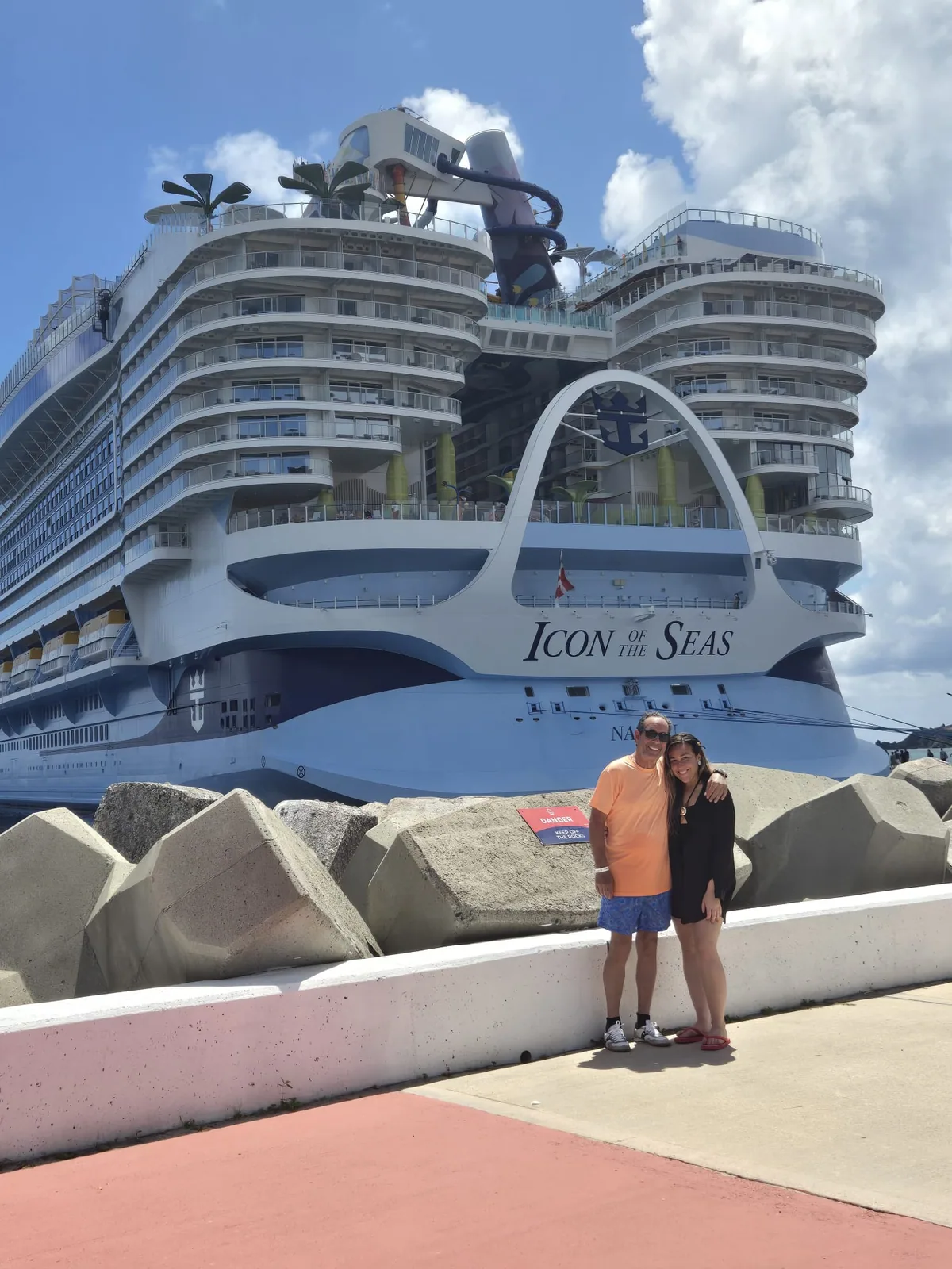 A guest beside a Royal Caribbean cruise ship
