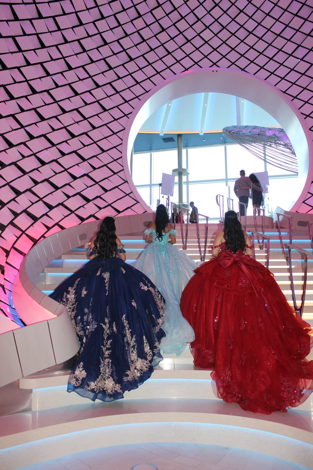 Quinceañeras in gala dresses inside the ship
